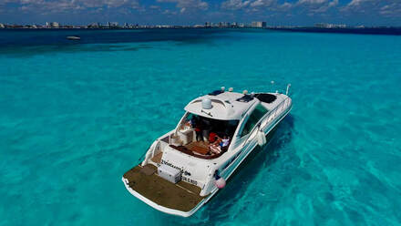 affordable yacht rental in Cancun with surrounding blue waters